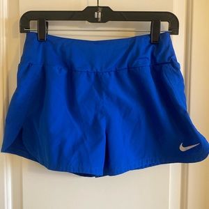 Nike size small athletic shorts with built in panty and back pocket.